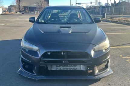 2010 Mitsubishi Lancer Evolution X SE

Extensive Modifications, Dyno-Verified 681hp, AWD, Black Exterior Wrap