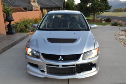 A Silver Mitsubishi Lancer Evo IX MR
6-Speed Manual Transmission; 9800 miles (15,771 km). LHD