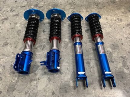 Cusco Street Zero A adjustable coilovers configured for the Mitsubishi Lancer Evolution V/VI (CP9A).