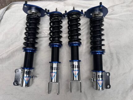 full set of four KTS SC Damper System adjustable coilover suspension struts featuring black springs, blue top mounts/collars, and silver lower bodies with warning decals for lancer evo 7/8/9.