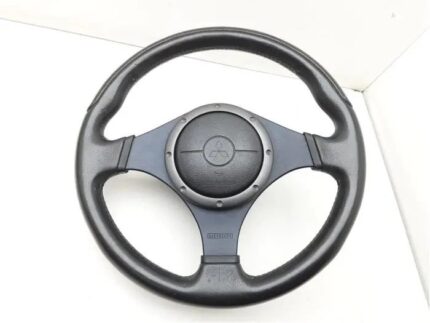 Genuine OEM MOMO leather steering wheel from a Mitsubishi Lancer Evolution VII, VIII, or IX (CT9A platform), featuring a three-spoke design with an integrated airbag module and debossed Mitsubishi and MOMO logos.