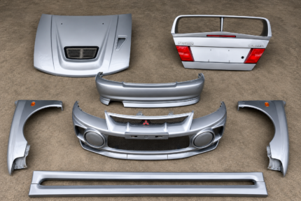 Set of OEM silver Mitsubishi Lancer Evolution IV/V (CP9A) Bodykits assembly.