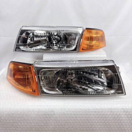 Brand new OEM Genuine Factory original headlights and amber corner light assembly designed for the Mitsubishi Lancer Evolution V and VI (1998–2001) models (also compatible with corresponding CK-series Lancer/Mirage platforms